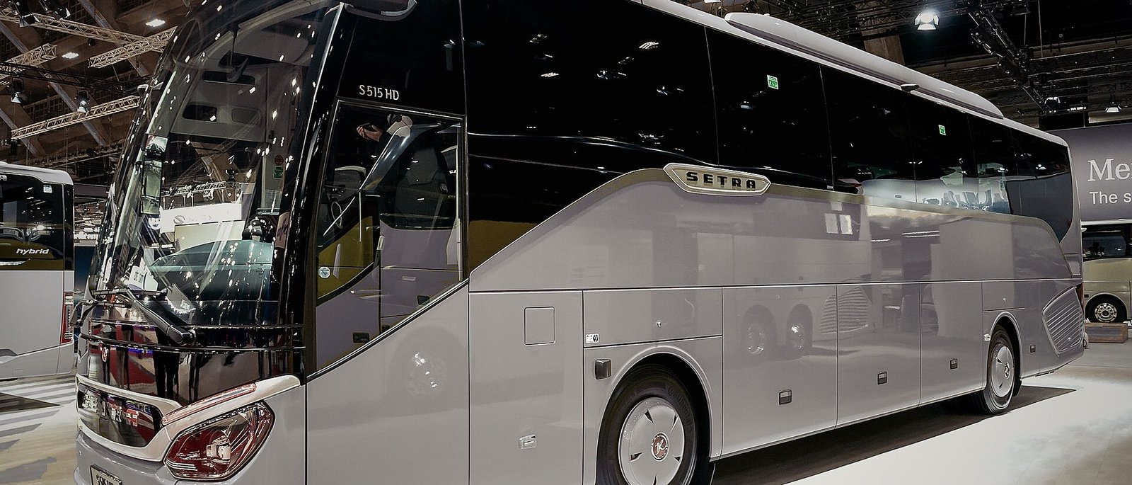 A premium touring coach photographed under studio lighting